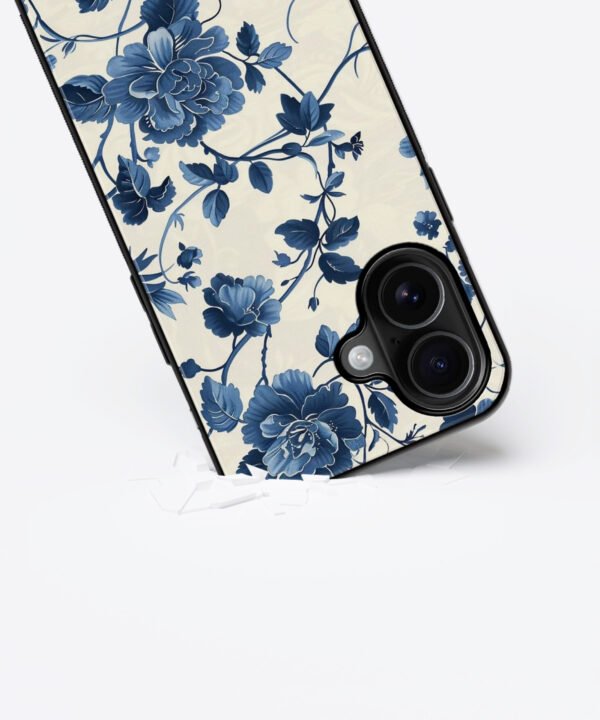 Blue Blooms Metal Case Cover for iPhone 16 Plus – Dropping View